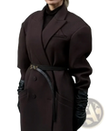 A structured dark brown wool oversized trench coat with belted waist paired with black leather gloves for fall