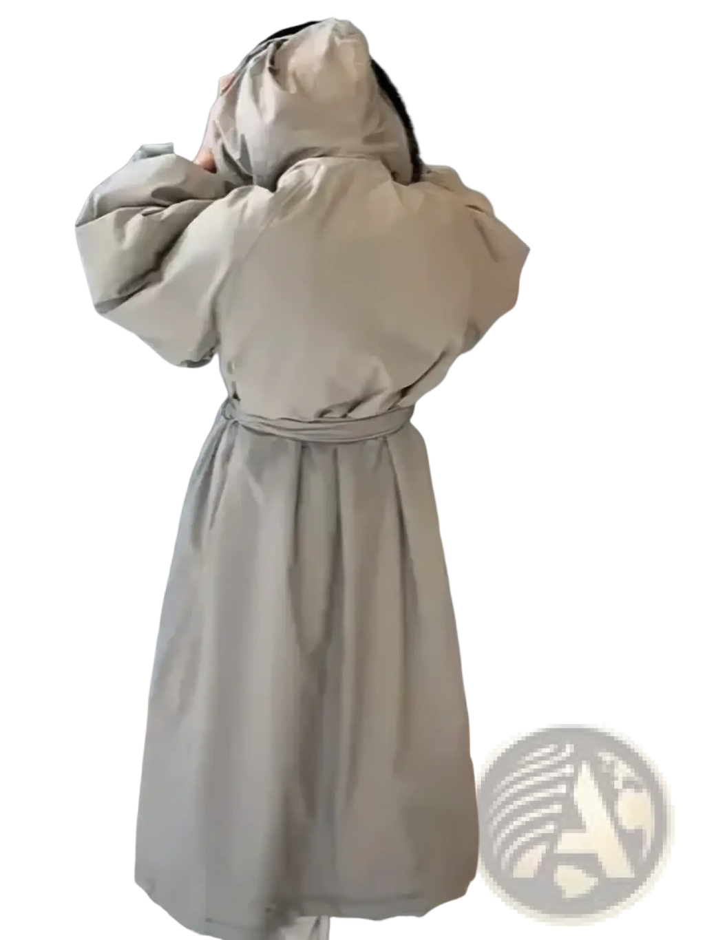 Beige oversized trench coat with hood and cinched waist in warm puffer material for winter outerwear use