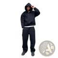 Black oversized unisex streetwear hoodie with drawstring hood and ribbed cuffs from sweatpants set, front view