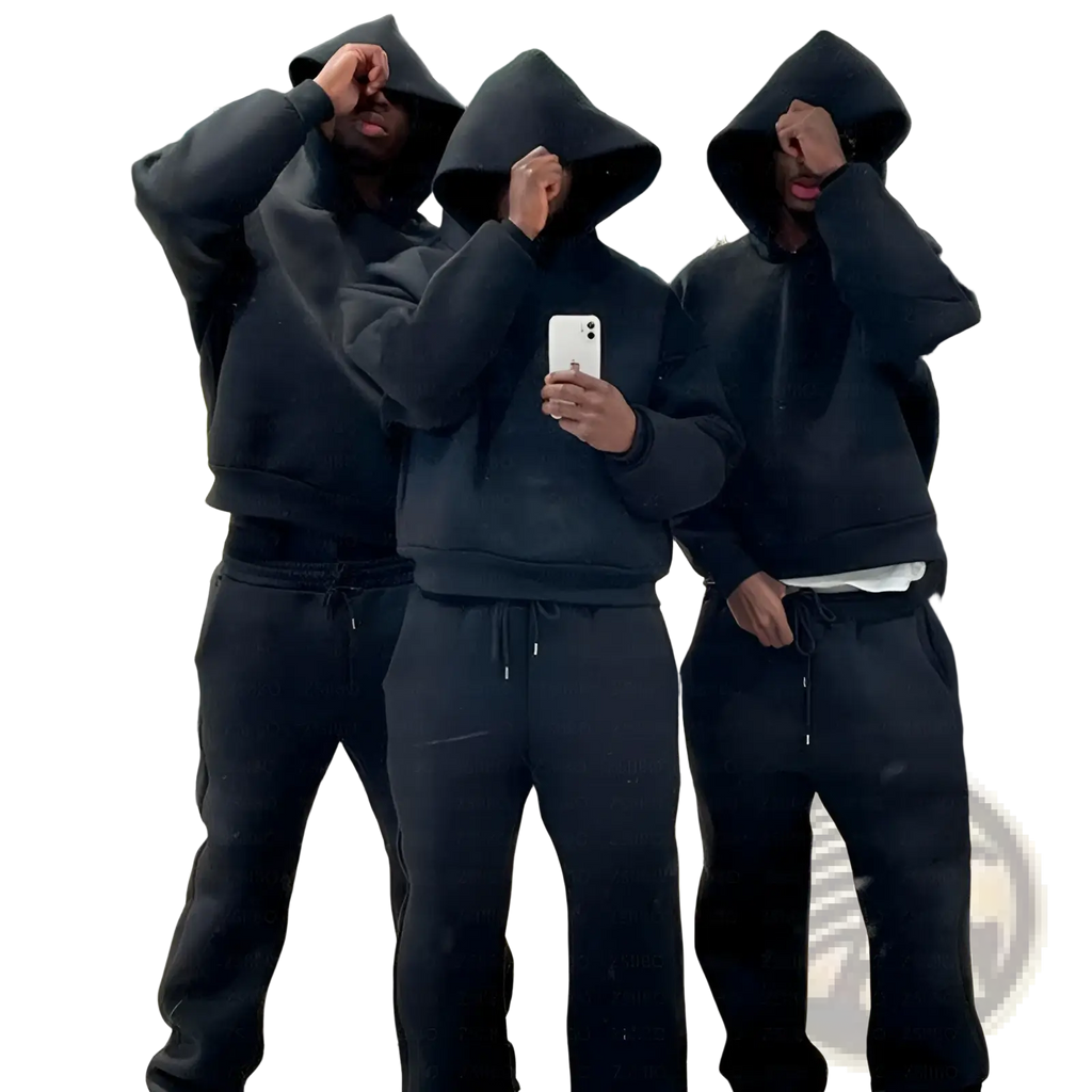 Three individuals wearing oversized unisex black cotton streetwear hoodies and sweatpants standing in a clothing store