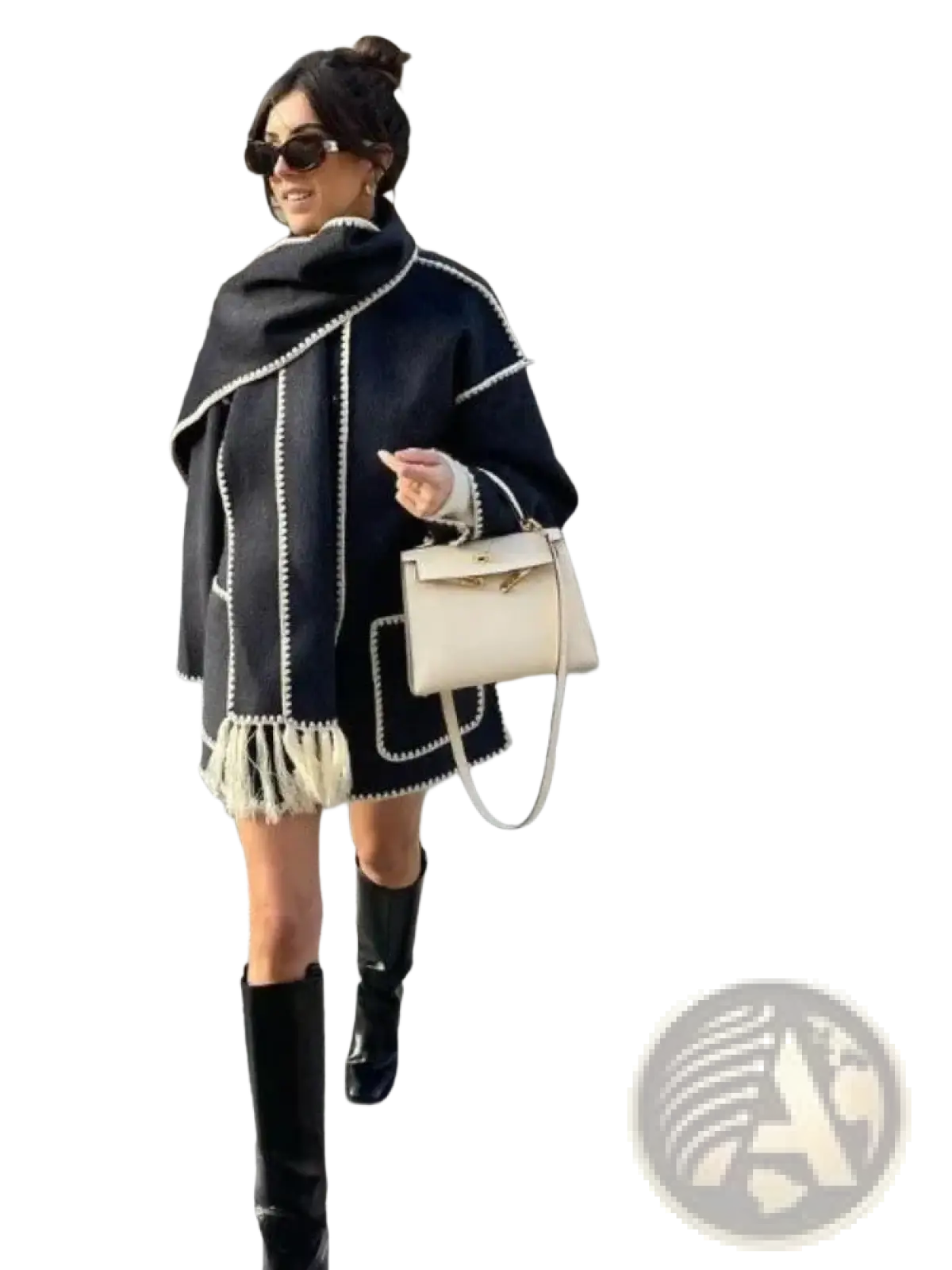 Oversized wool blend coat with black and white beaded trim and fringe detailing shown from the back side
