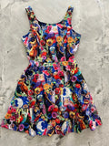 A vibrant sleeveless a-line skater dress with colorful owl and floral print on a deep blue background