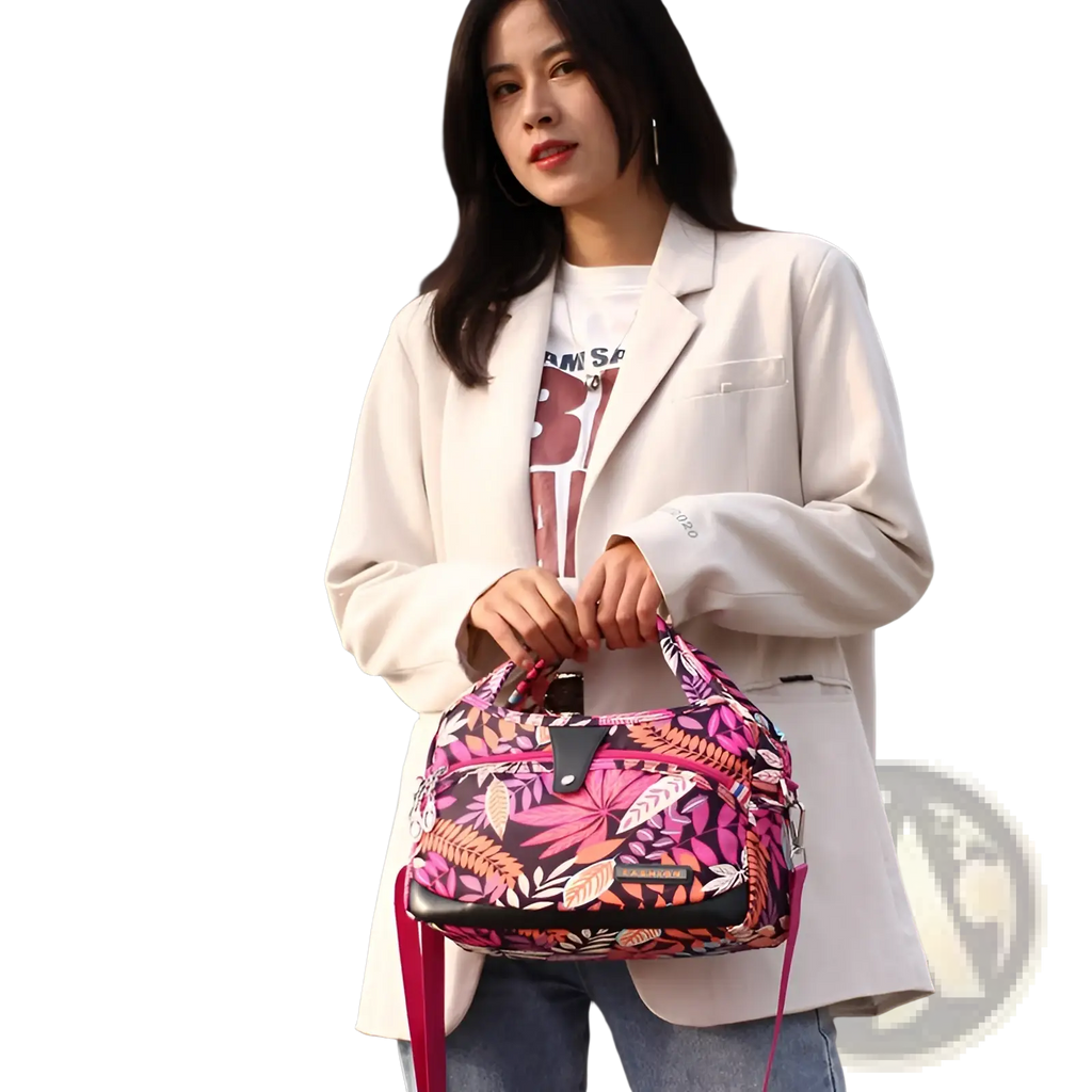 Oxford cloth floral messenger bag featuring a vibrant pink and black floral pattern with a sleek modern design