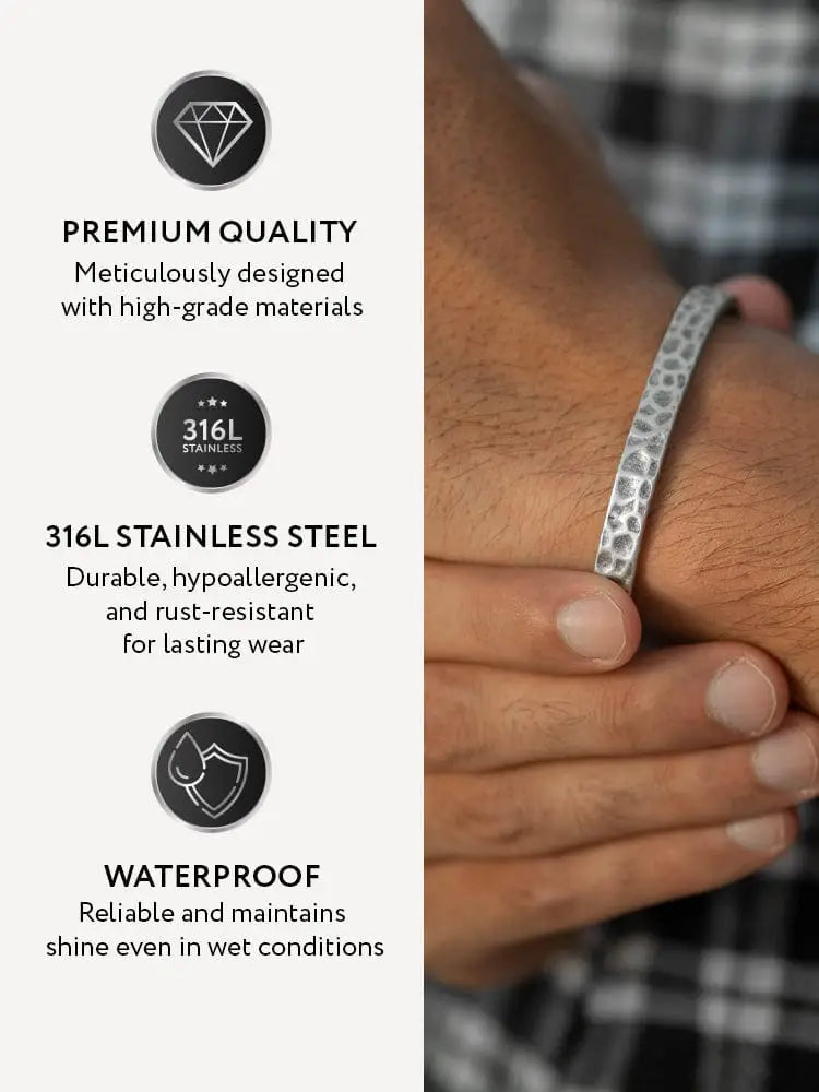 Oxidized hammered silver stainless steel cuff bracelet featuring a textured hammered finish in 316l silver