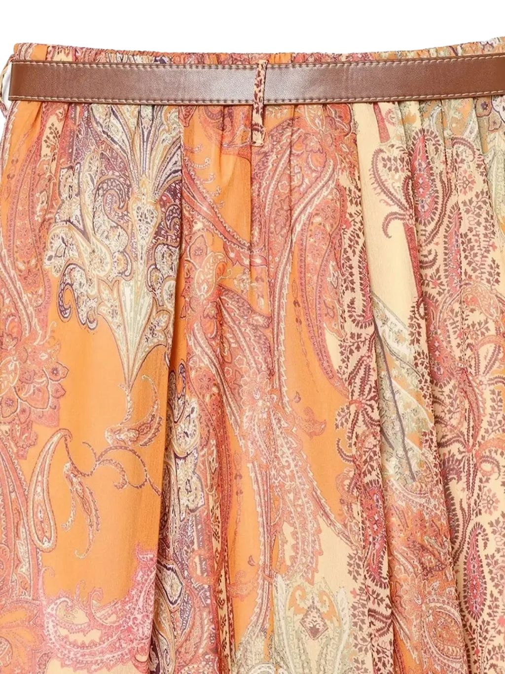 Paisley print high waist midi skirt with vibrant orange and beige pattern and brown leather belt at the waist
