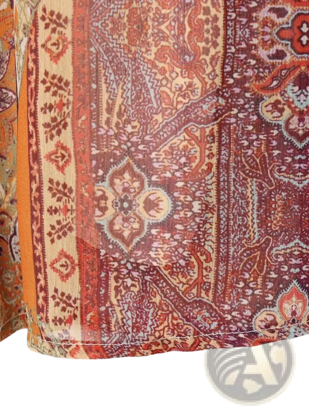 A vibrant paisley print high waist midi skirt made of sheer fabric in red and orange tones
