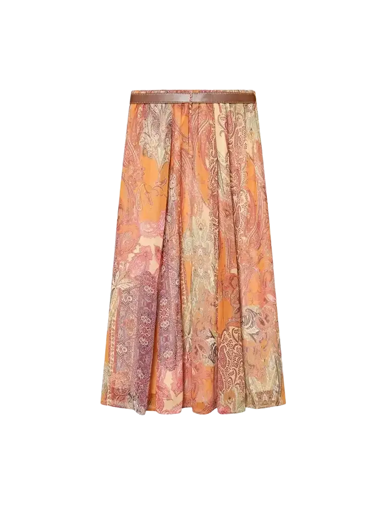 A flowing high waist midi skirt in warm orange rust and beige paisley print with a matching brown belt