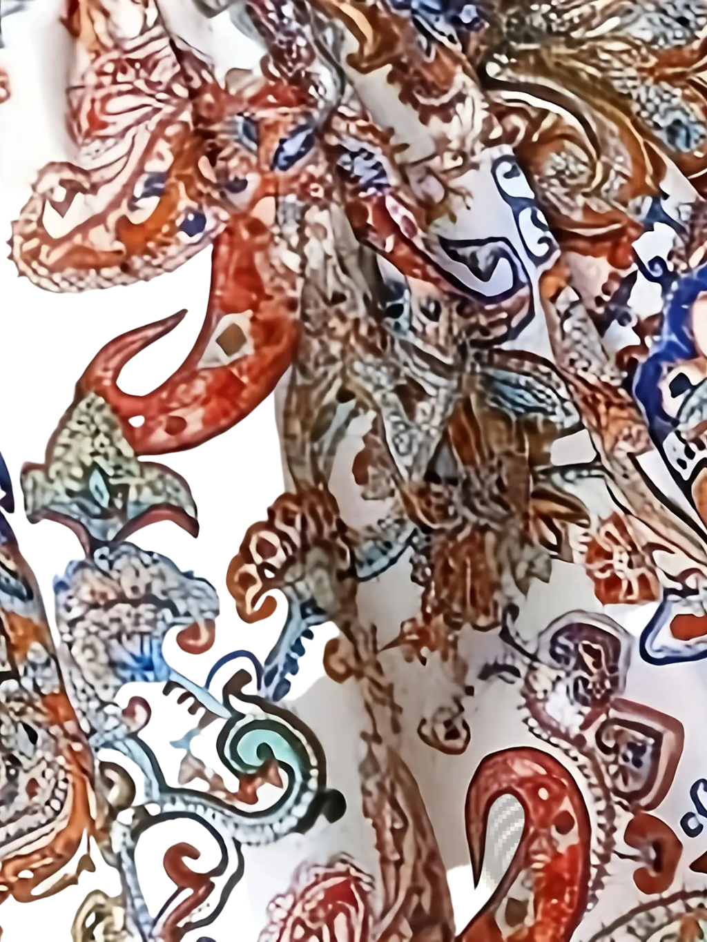 Paisley print spaghetti strap top with vibrant rust teal and navy paisley pattern on white fabric for casual wear