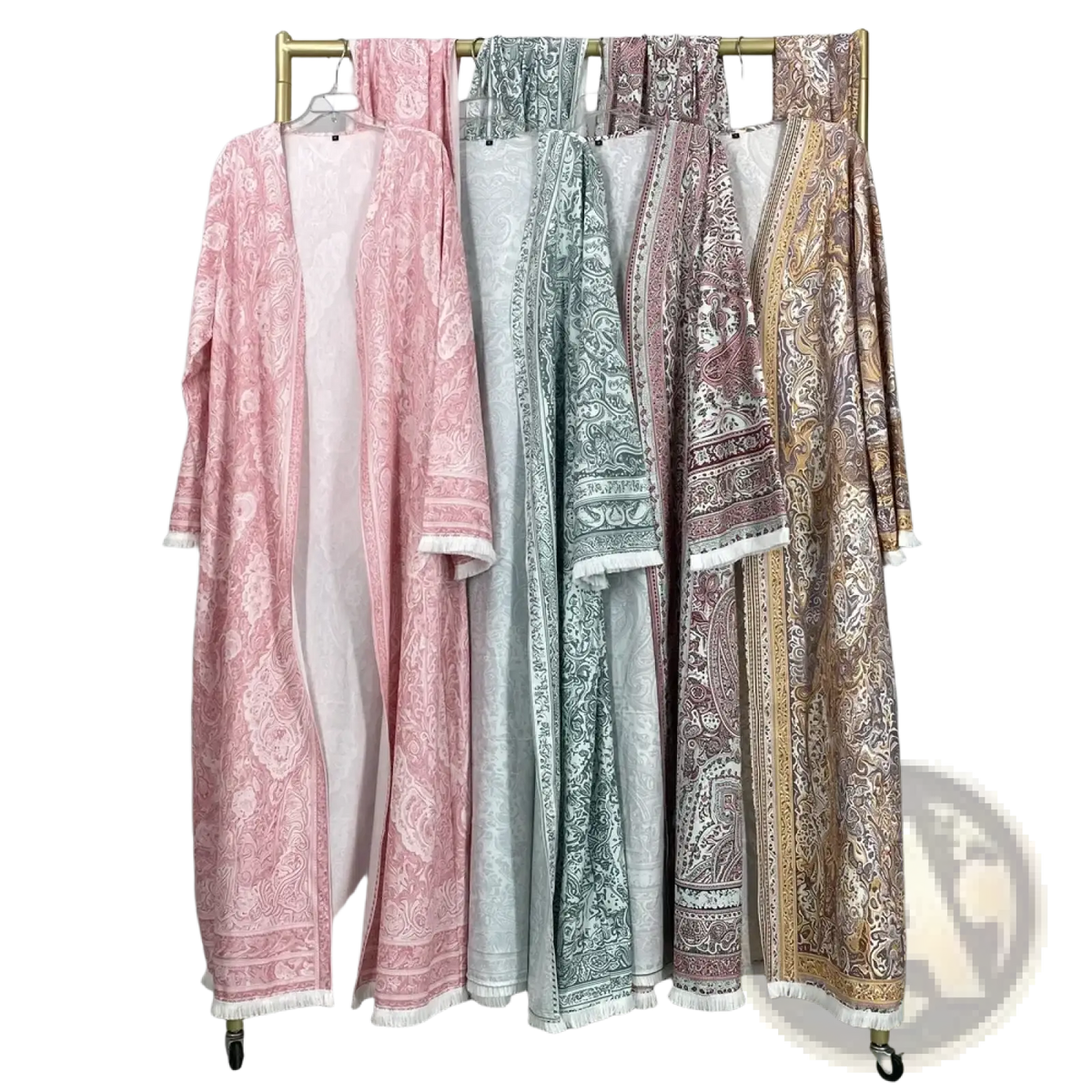A collection of paisley tassel open abaya Islamic robes in soft pastel and earthy tones with white fringed hems