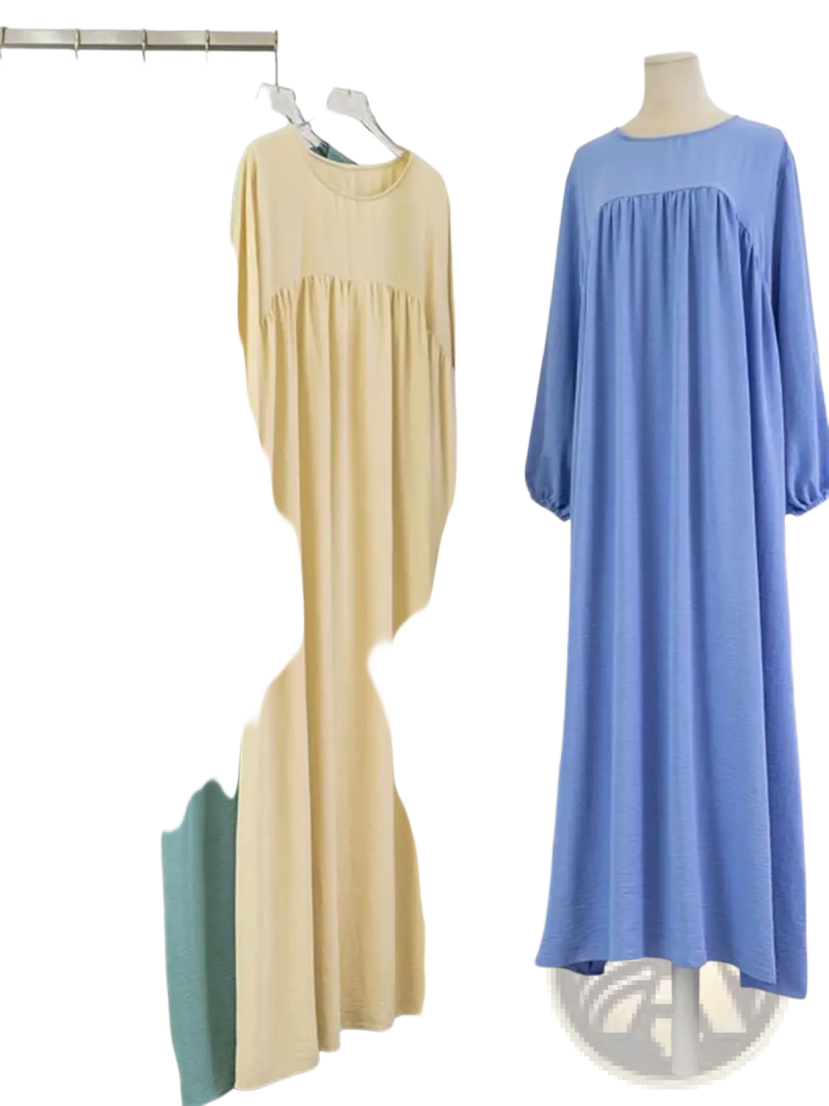 A pale yellow Dubai abaya long modest dress with soft flowing fabric gathered waist and elasticated long sleeves