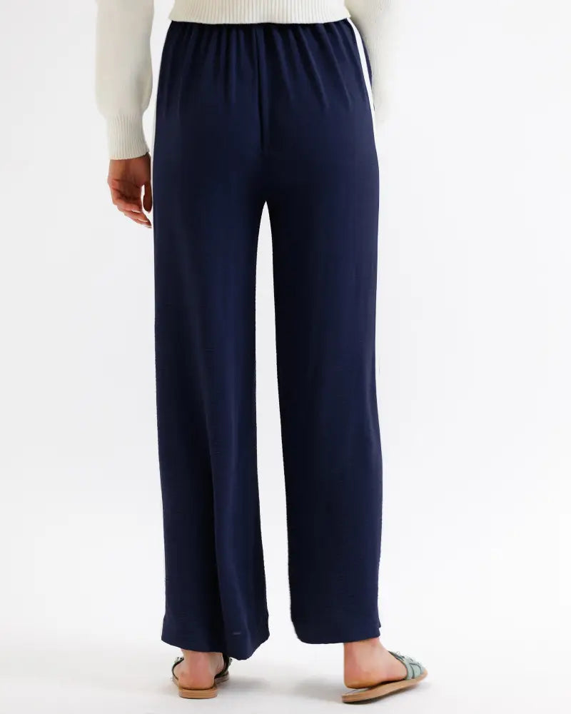 Parisian high waist navy wide leg pleated trousers in soft stretchy fabric with subtle side seam detailing