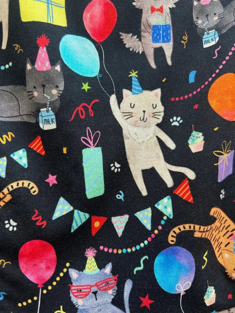 Party cats retro fit and flare cotton dress in black fabric with cartoon cats wearing party hats holding balloons and gifts
