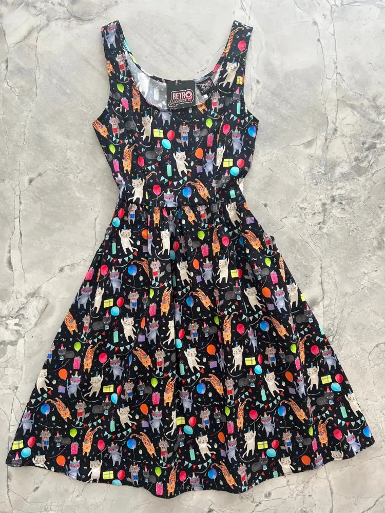 Party cats retro fit and flare black cotton dress with pockets featuring colorful cartoon cats and party decorations