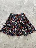 A black cotton party cats retro skater skirt with colorful cats balloons and party decorations playful pattern