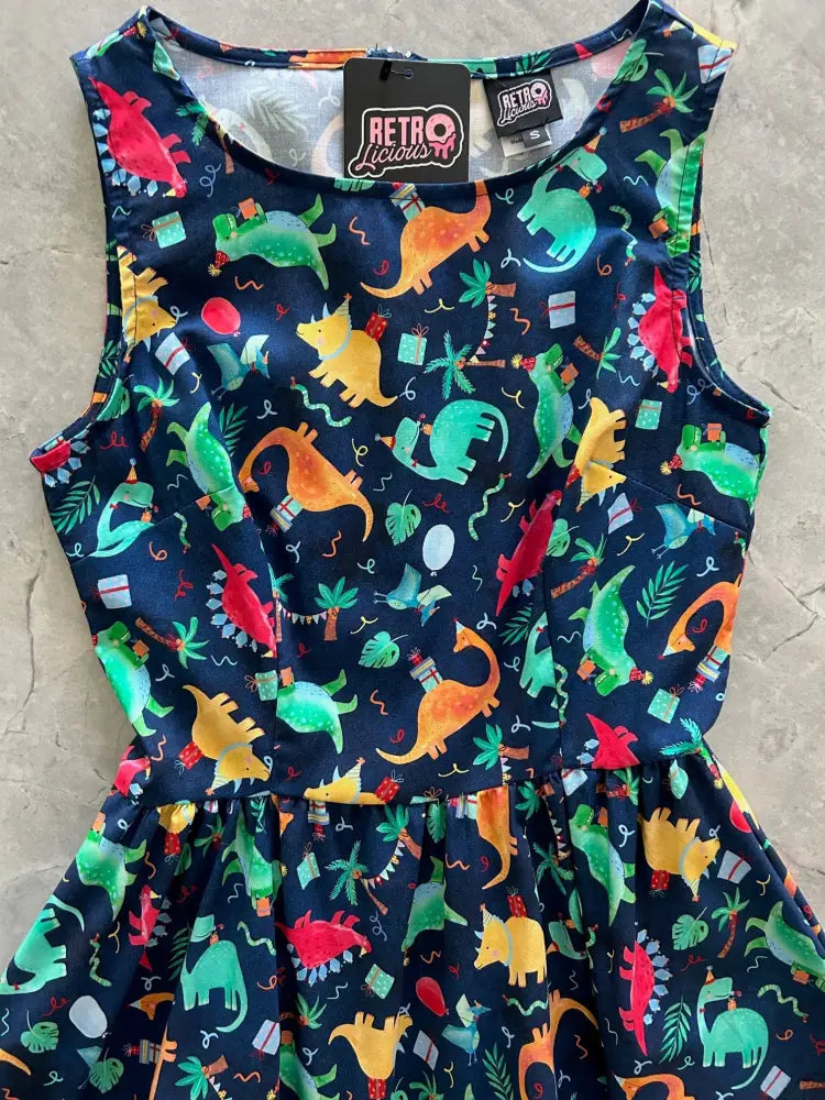 Vintage party dinos navy cotton sleeveless dress with colorful dinosaur and tropical plant pattern for festive occasions