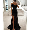 Black off the shoulder sequined mermaid gown with high slit and train showcasing elegant evening wear style