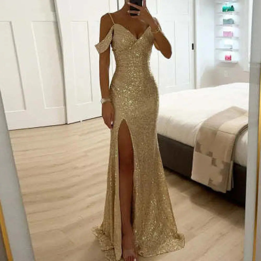 Off the shoulder gold sequin mermaid gown with a high slit and shimmering fabric perfect for formal events