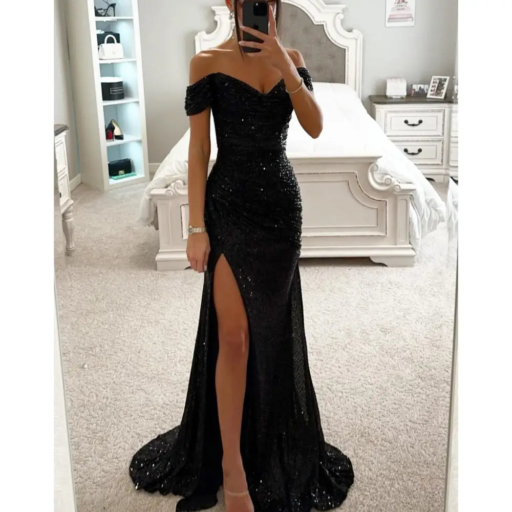 Black off the shoulder sequined mermaid gown with high slit and train for elegant formal occasions