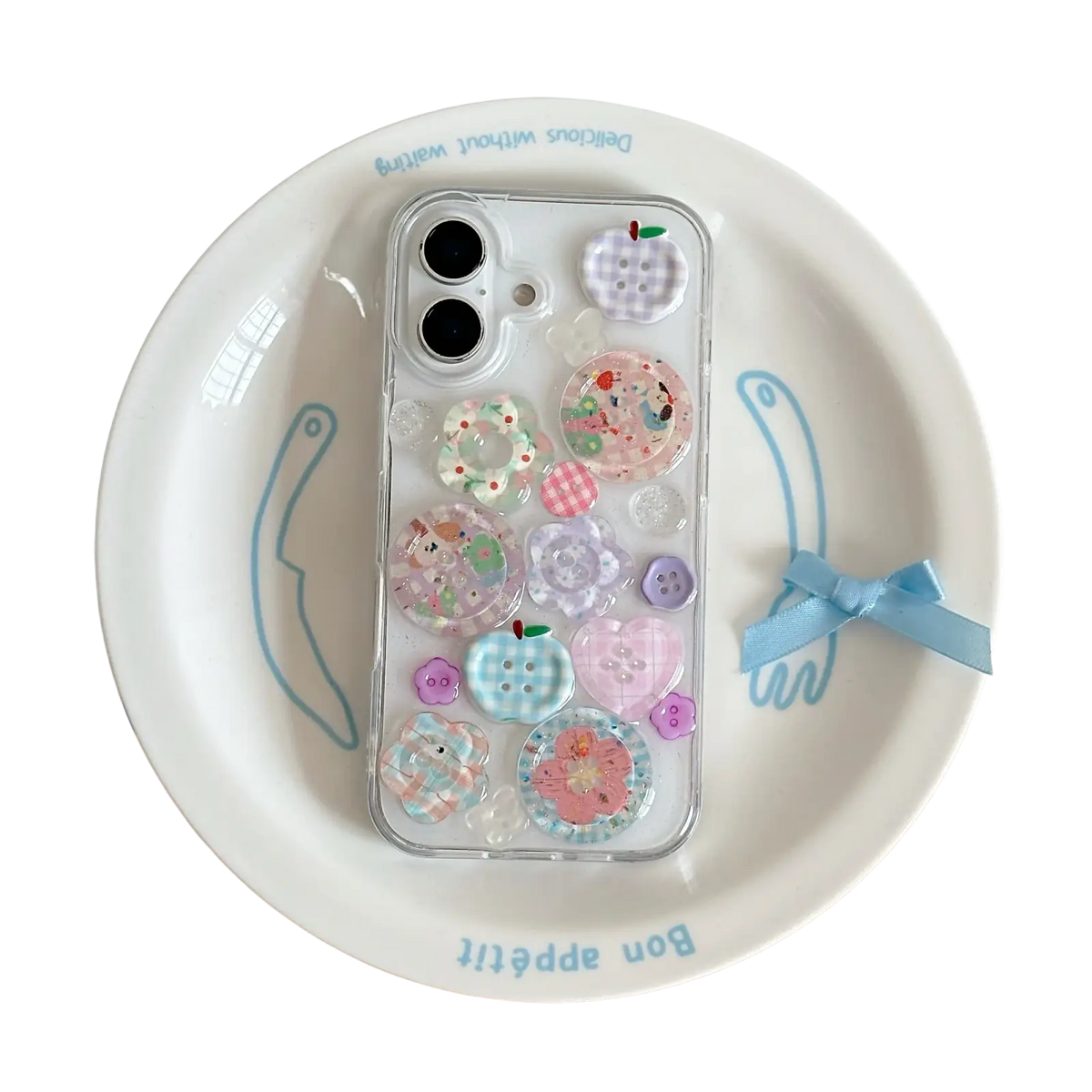 A clear iphone case decorated with pastel pink blue and purple decorative buttons shown from the back side