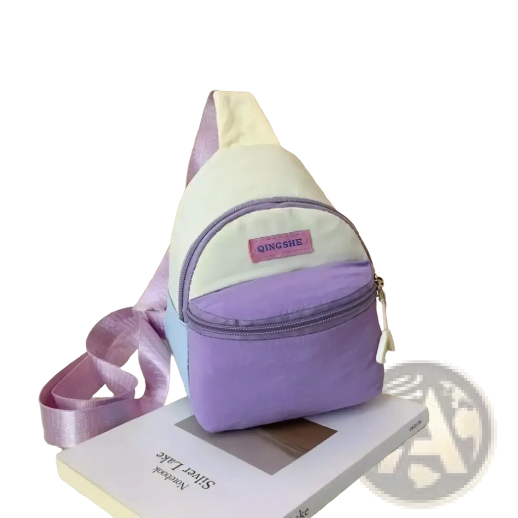 Pastel kids crossbody bag by Qingshe in pastel purple and cream with satin strap lightweight chest pack design
