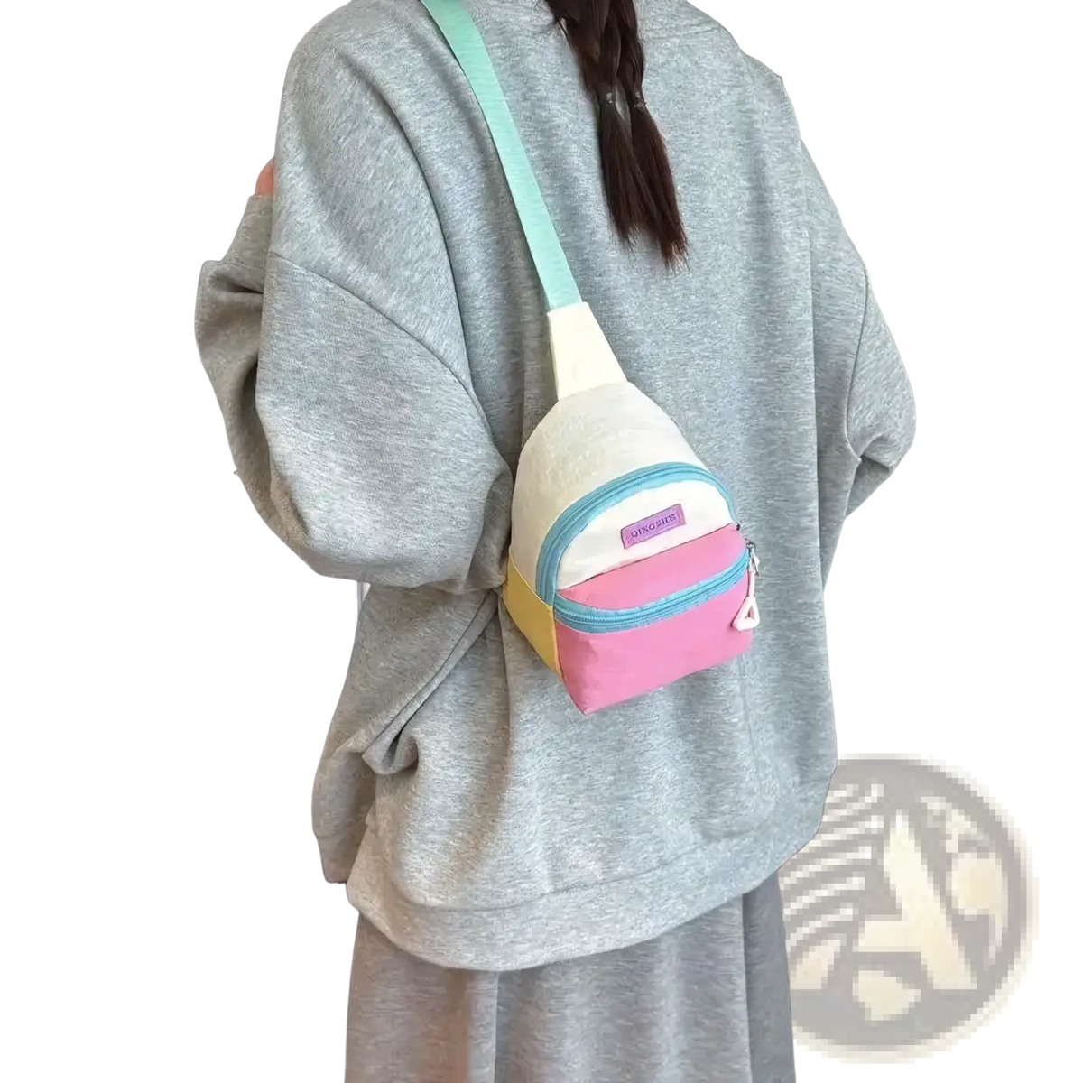 Pastel kids crossbody bag with lightweight canvas material, featuring mint green strap and pink yellow white panels