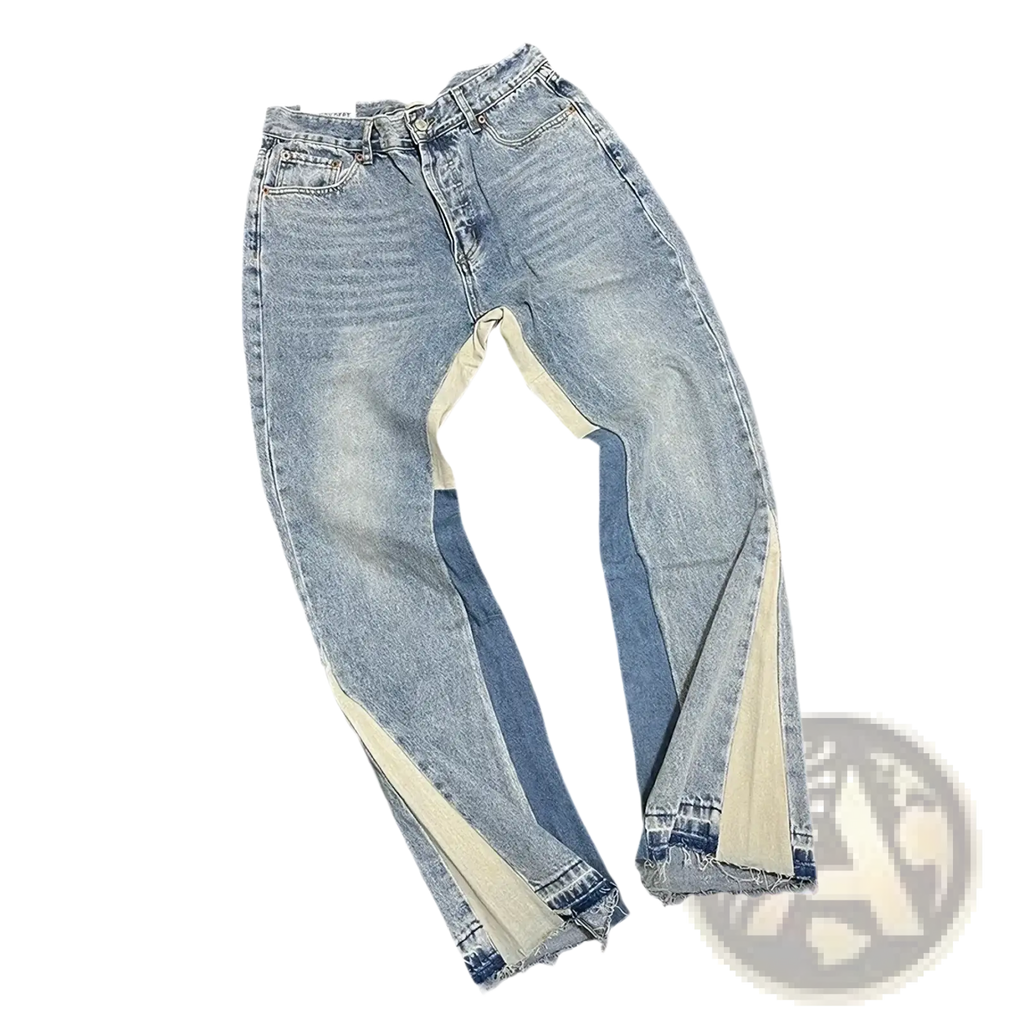 Light-wash denim bell bottom jeans with flared legs and contrasting beige and dark blue patchwork along seams