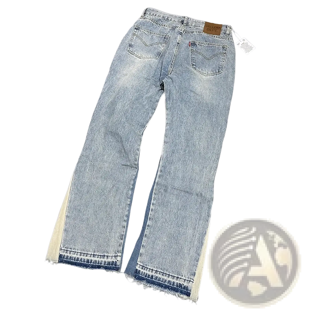 Light-wash denim patchwork bell bottom jeans with frayed hems and cream-colored contrasting side panels