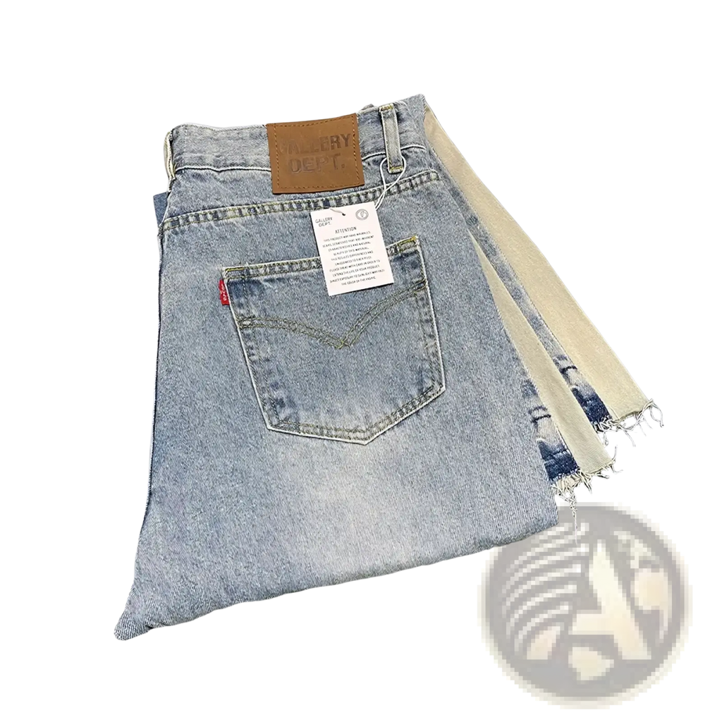 Light-wash patchwork denim bell bottom jeans with frayed hem and brown leather brand patch on the waistband back side