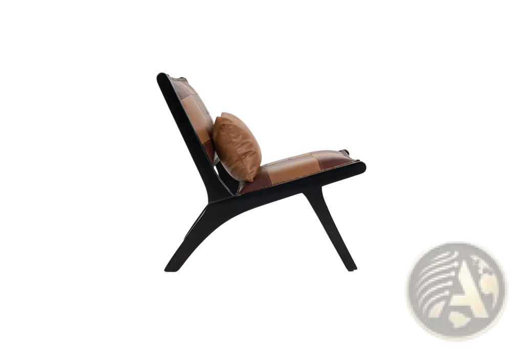 A sleek patchwork leather accent chair with tan seat and backrest and black wood frame with matching cushion