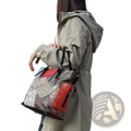 Patchwork leather women’s messenger shoulder bag featuring red silver and brown floral-patterned panels in tote style