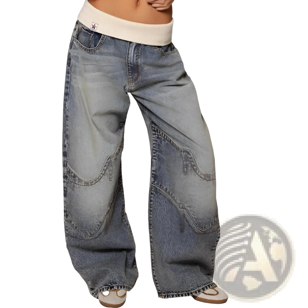 Wide-leg denim jeans with faded blue wash and patchwork design featuring contrasting stitching for casual wear
