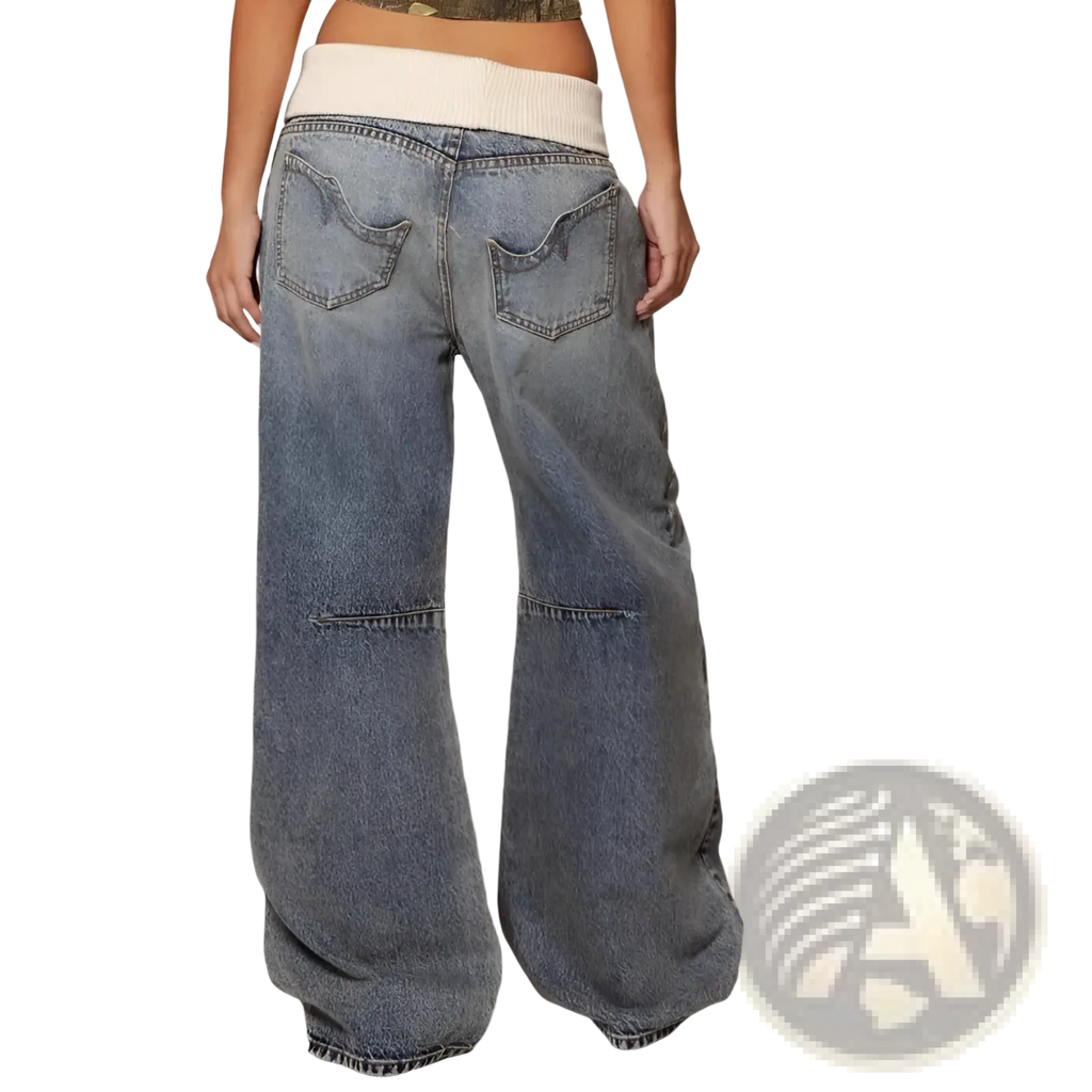 Wide-leg denim jeans with faded blue wash and contrasting cream elastic waistband for casual wear women pants