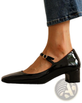 Black patent leather mary jane block heel shoe with square toe and gold-toned buckle for elegant wear