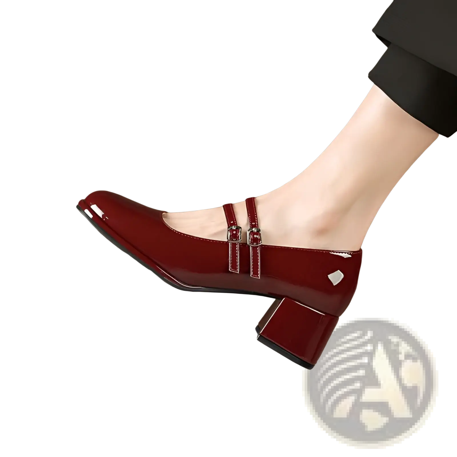 A glossy burgundy patent leather mary jane shoe with double buckle straps and a block heel
