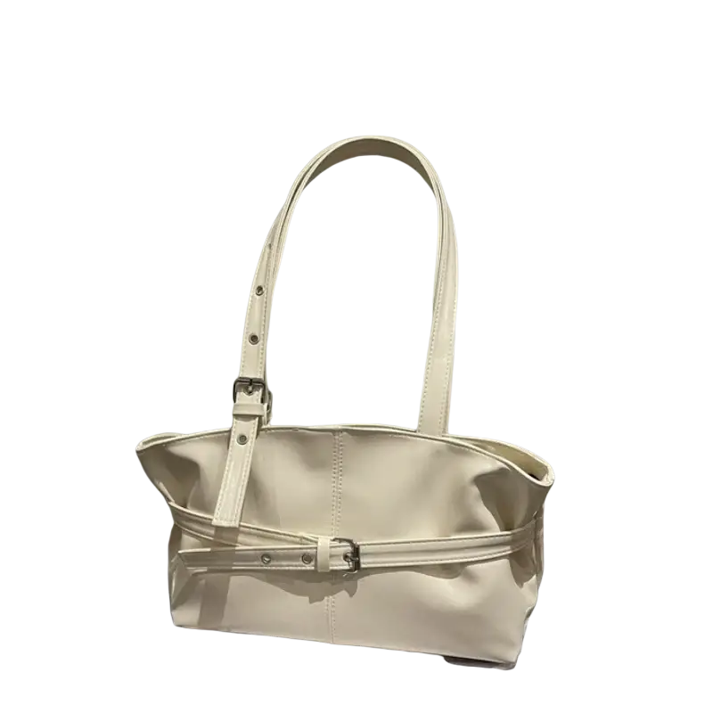 Cream-colored patent leather shoulder bag tote with adjustable shoulder strap and silver-toned buckle accents