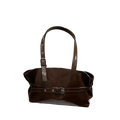 A glossy brown patent leather tote bag with adjustable silver buckles and a shoulder strap for versatile use
