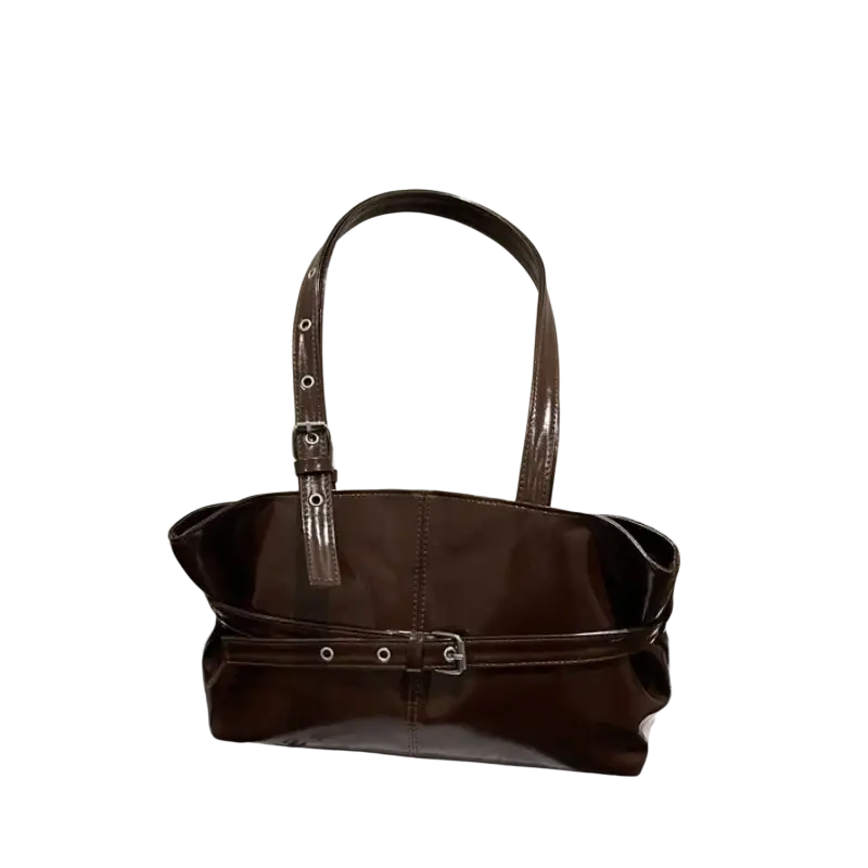 A glossy brown patent leather tote bag with adjustable silver buckles and a shoulder strap for versatile use