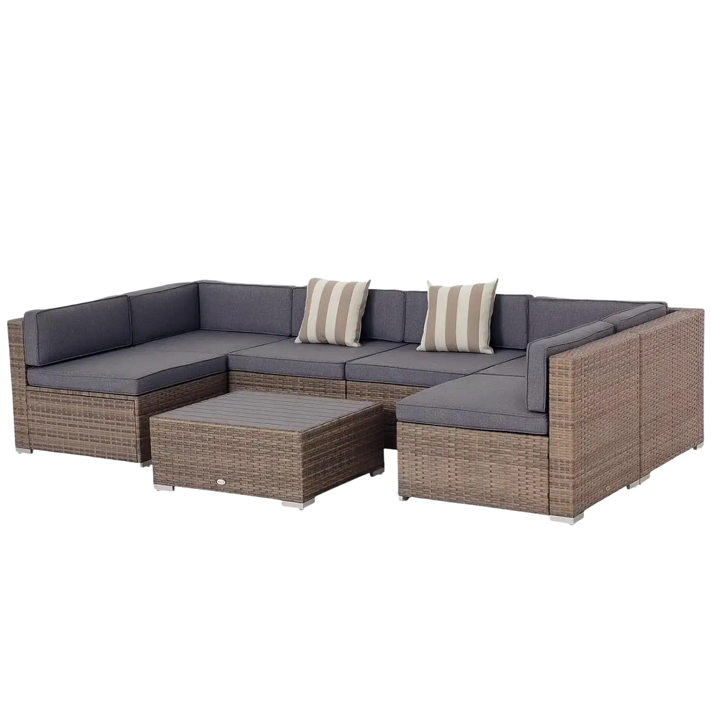 Gray cushioned outdoor wicker sectional sofa with striped pillows and coffee table in a 7 piece patio furniture set