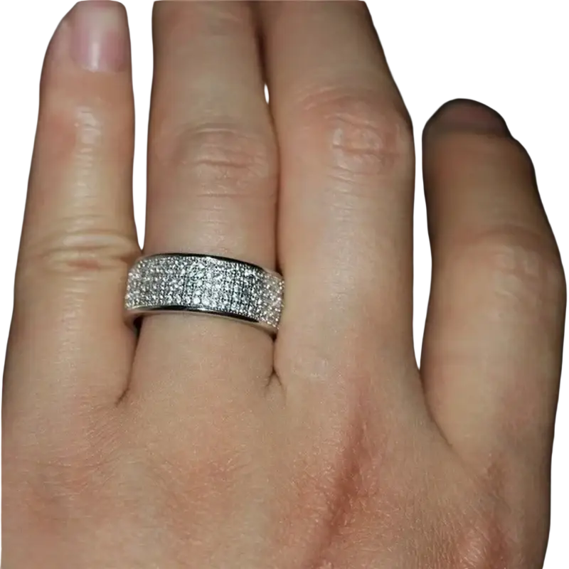 A sleek silver-toned wide band paved zircon wedding engagement ring with clear cubic zirconia stones