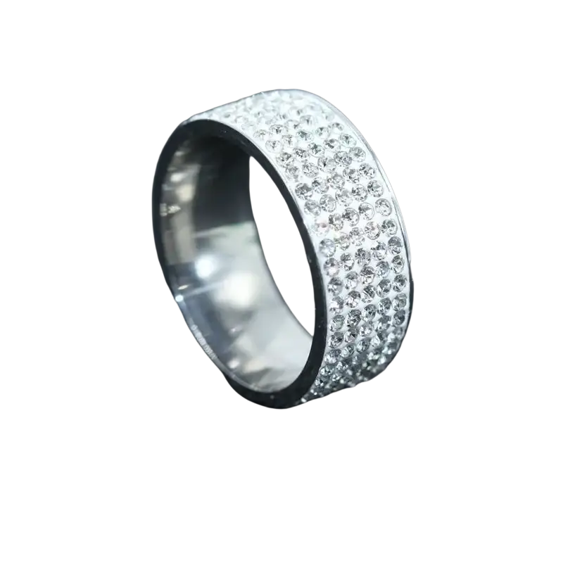 A wide sleek silver paved zircon wedding engagement ring with a dense band of sparkling clear crystals