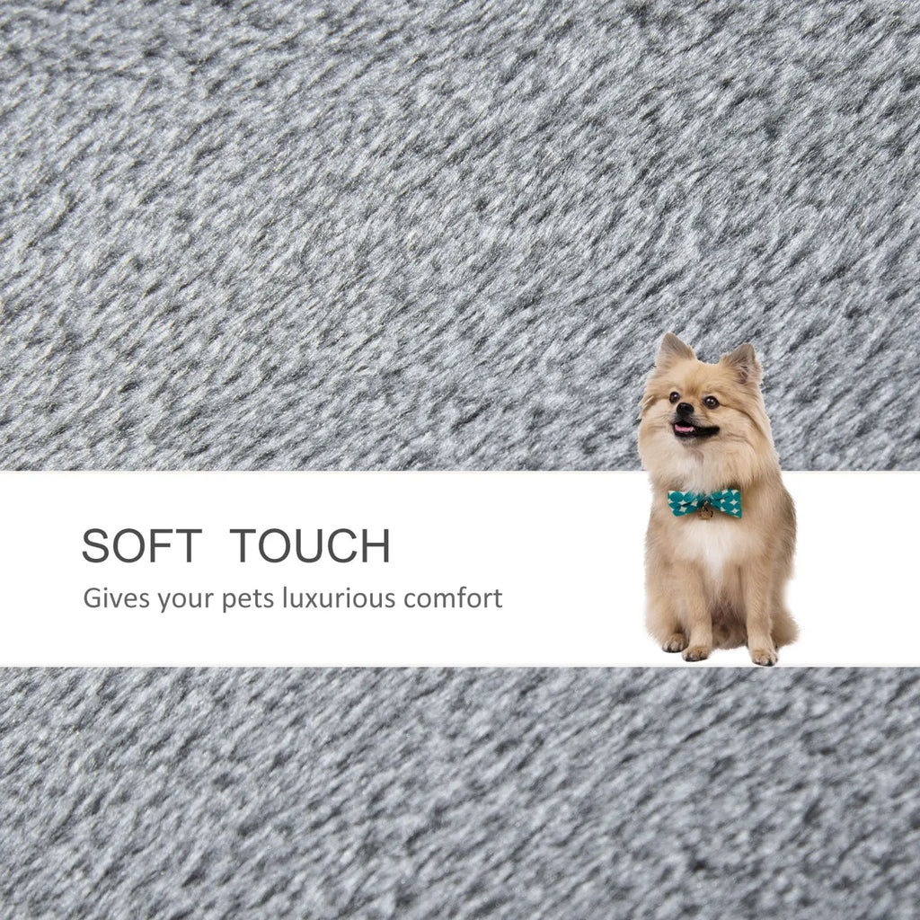 A fluffy tan pomeranian with teal bow tie sits on textured gray fabric of Pawhut gray four step cat tree with scratching posts