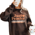 A cozy dark brown oversized sweatshirt with distressed orange just peachy graphic and horizontal stripes