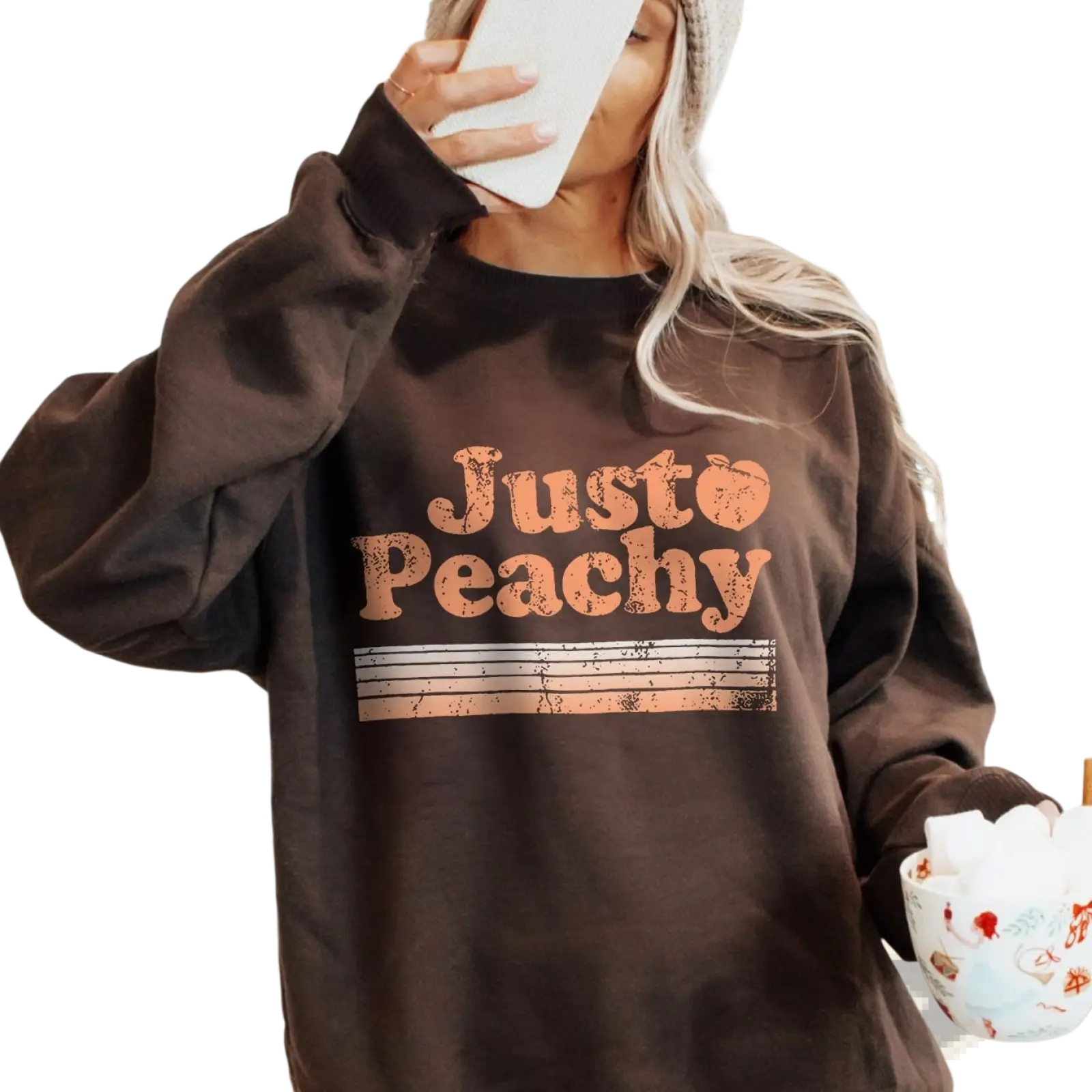 A cozy dark brown oversized sweatshirt with distressed orange just peachy graphic and horizontal stripes