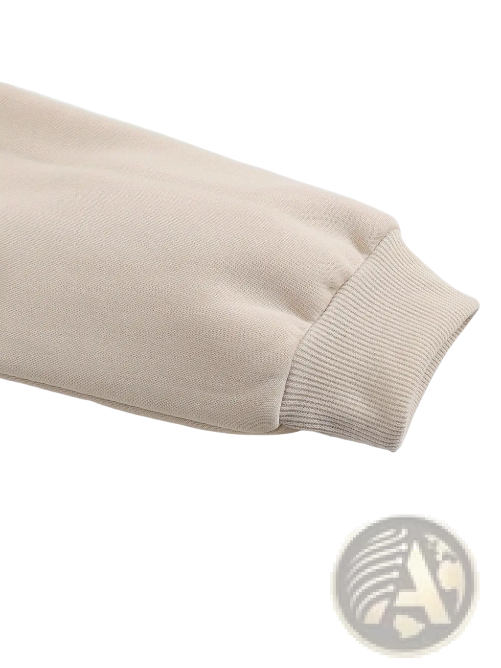 Beige fleece sleeve with ribbed cuffs on peachy print oversized cream sweatshirt showing soft material and cozy design
