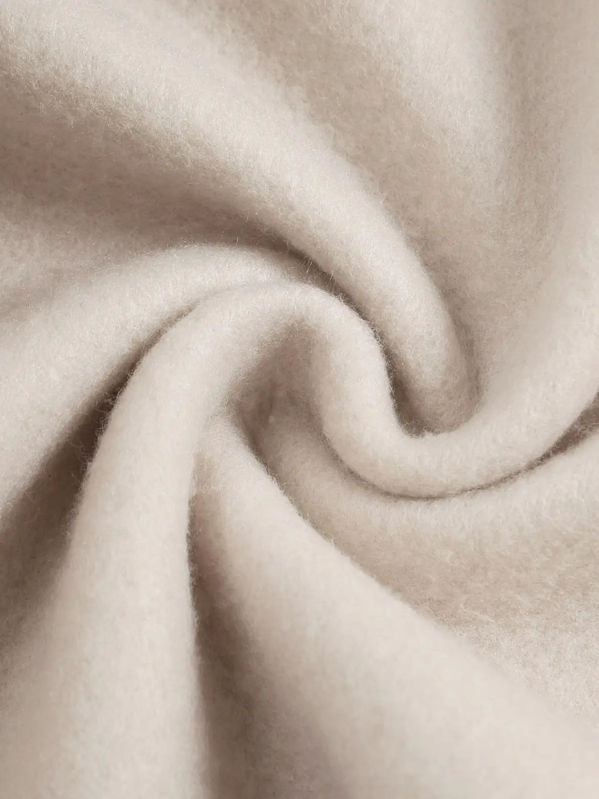 Soft cream-colored woolen fabric with a plush texture featured on the peachy print oversized cream sweatshirt