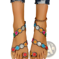 Peacock embroidery flat sandals for women featuring colorful circular embellishments on tan leather straps