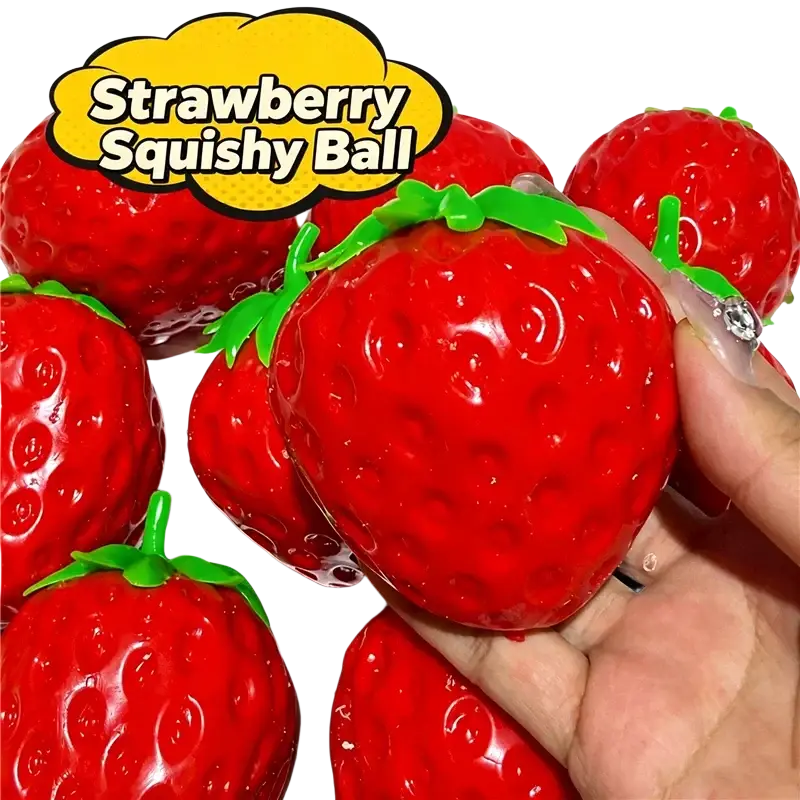 A glossy red strawberry-shaped peanut stress ball sensory fidget toy with a green leafy top for sensory relief
