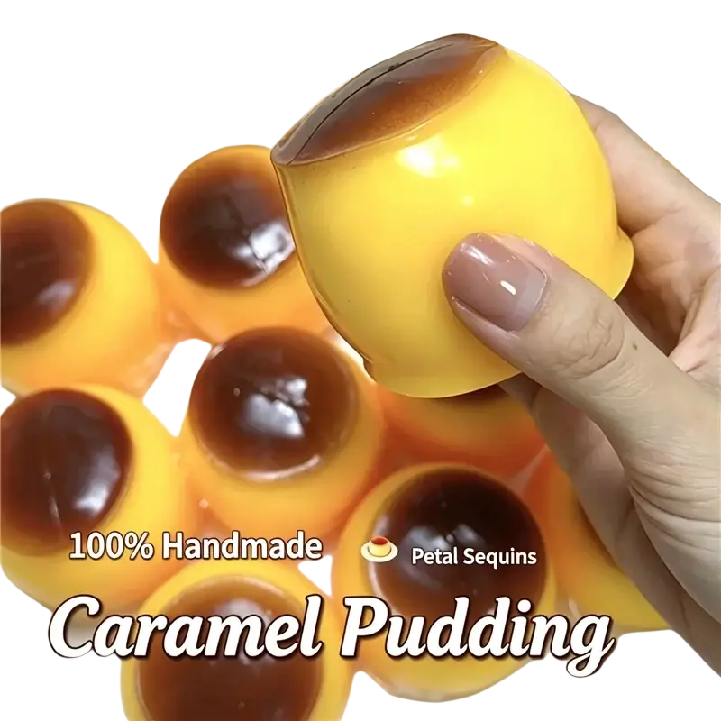 A glossy yellow caramel pudding styled peanut stress ball sensory fidget toy with a dark brown seared top