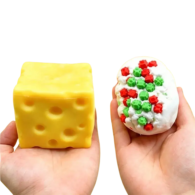 Yellow and white cheese-shaped peanut stress ball sensory fidget toys with red and green star decorations