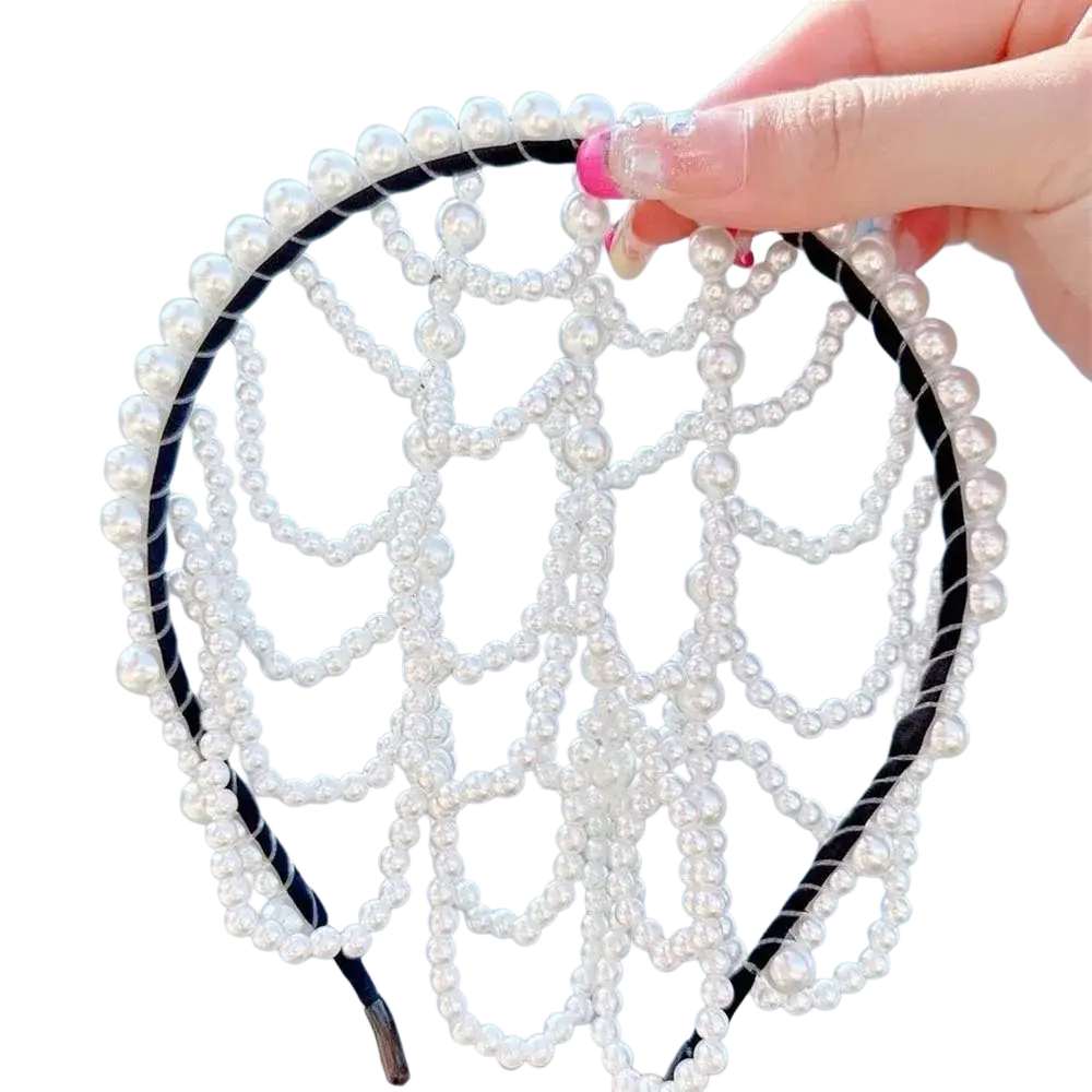 A delicate white pearl bridal crown hair band with a black braided base and intricate beaded tassel design